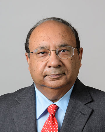 Headshot of a South Asian man